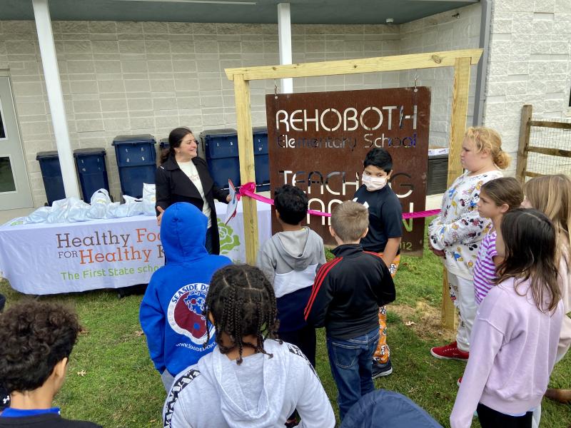 Healthy Foods for Healthy Kids Community Engagement and Partnerships Director Anita Broccolino applauds students and teachers for creating their own sustainable garden.